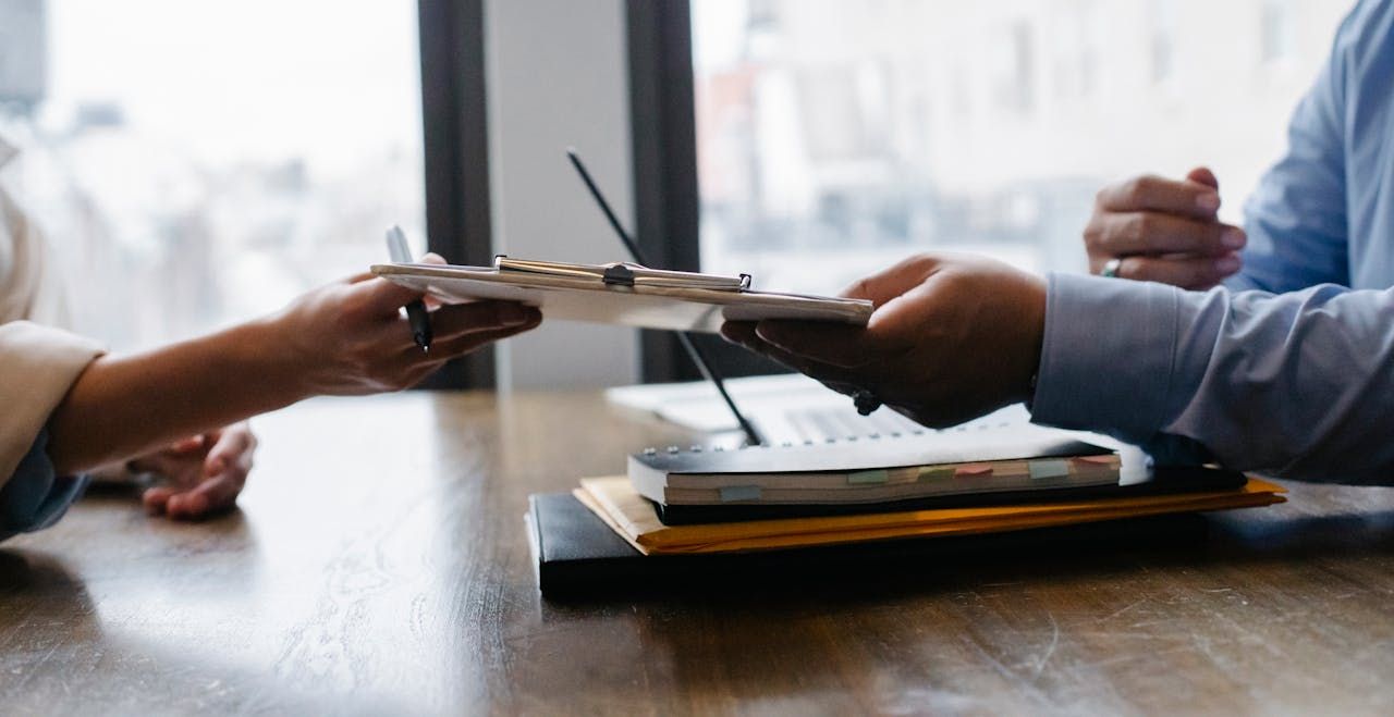 Apo VA virtual assistant handing a resume to a hiring manager